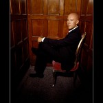 Lex Luthor On Chair Portrait Wallpaper